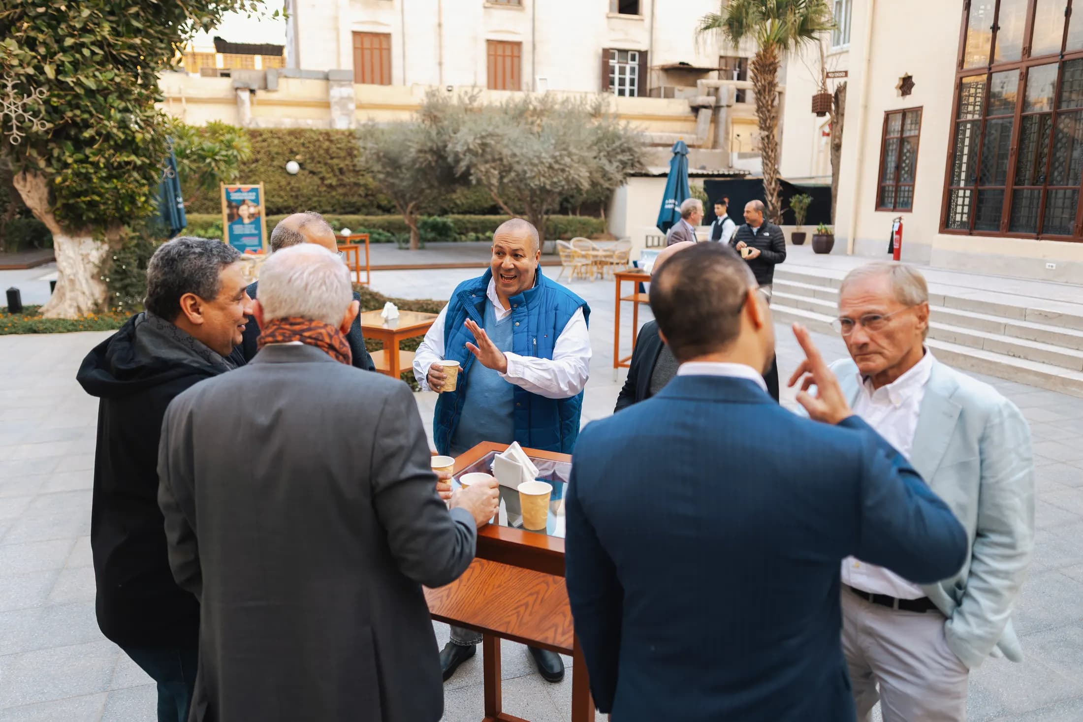 A member telling a story to a group around a table